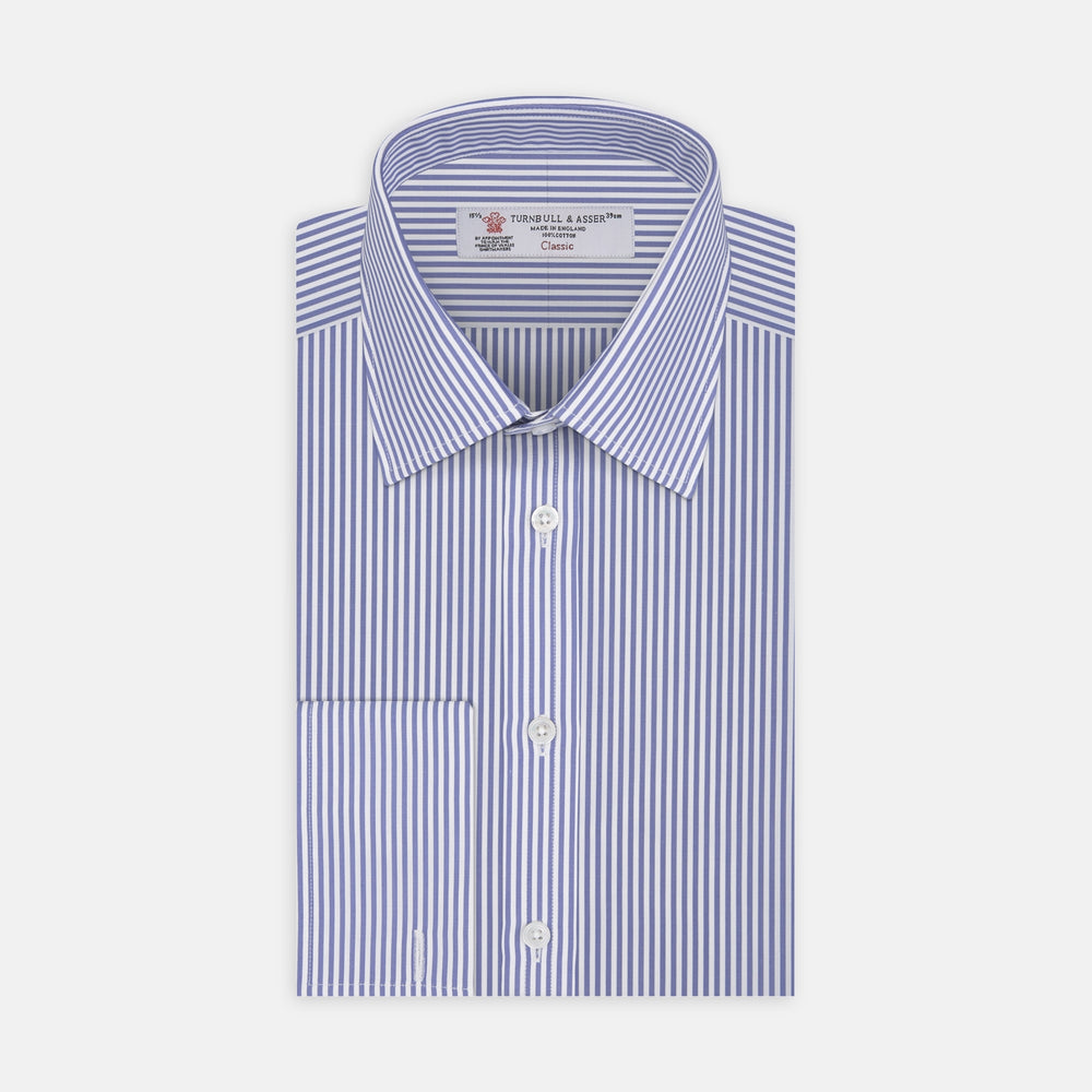 The Turnbull & Asser Blue Bengal Stripe Shirt features a T&A collar, double cuffs, and crisp white buttons. Made from cotton with blue and white bengal stripes, it’s neatly folded and displayed on a white background.