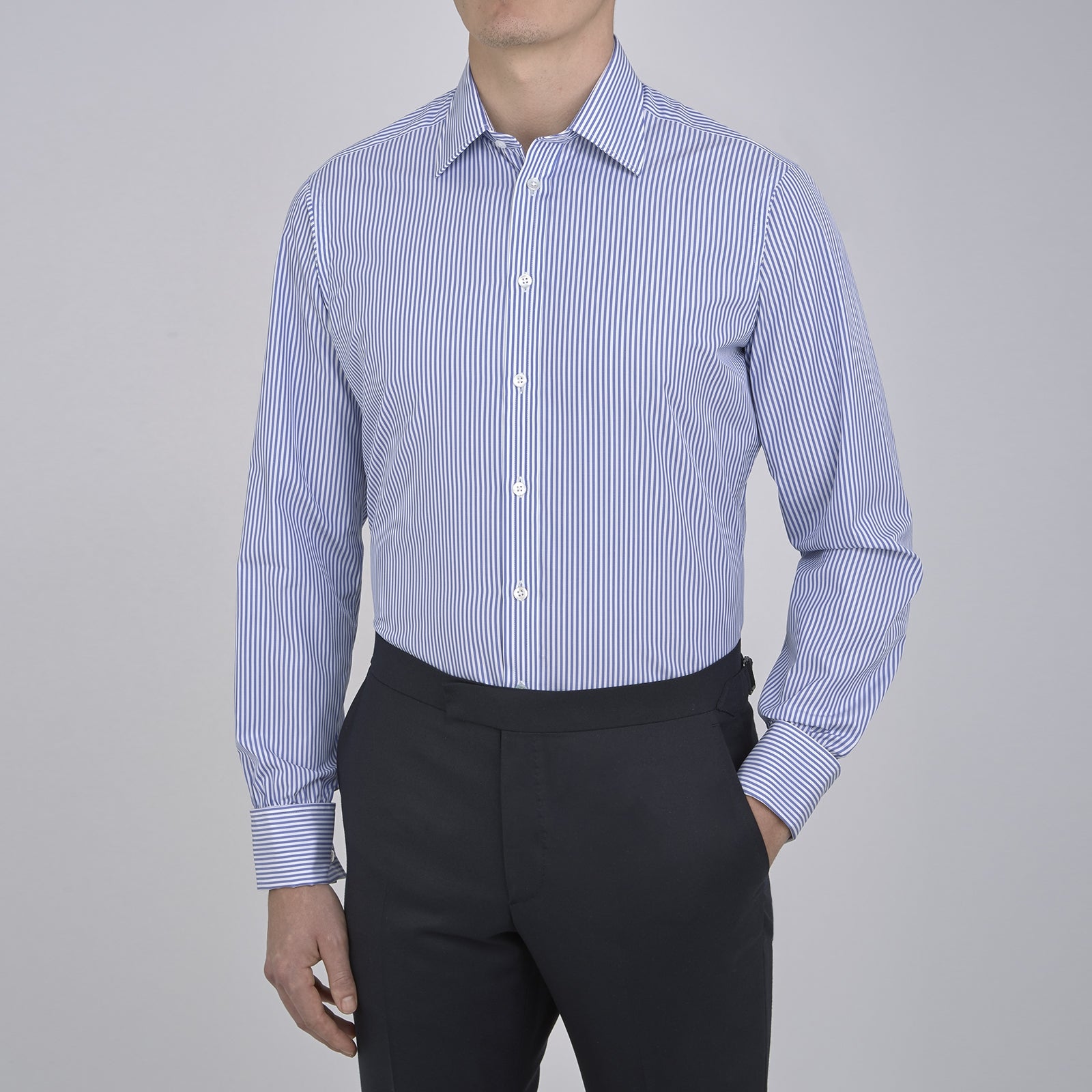 View 2 of product The Turnbull & Asser Blue Bengal Stripe Shirt features a T&A collar, double cuffs, and crisp white buttons. Made from cotton with blue and white bengal stripes, it’s neatly folded and displayed on a white background.