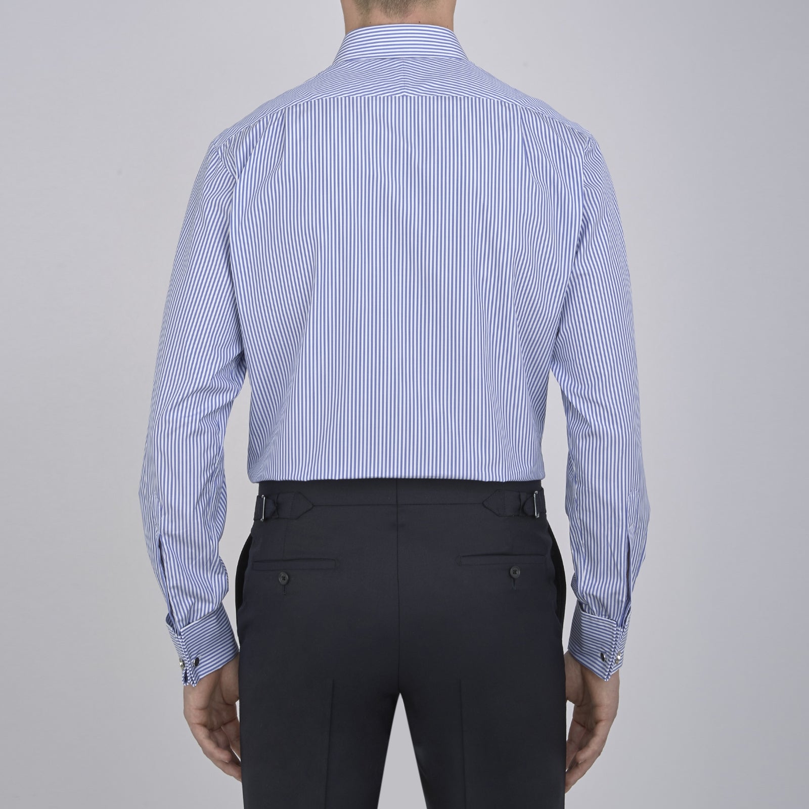 View 3 of product The Turnbull & Asser Blue Bengal Stripe Shirt features a T&A collar, double cuffs, and crisp white buttons. Made from cotton with blue and white bengal stripes, it’s neatly folded and displayed on a white background.