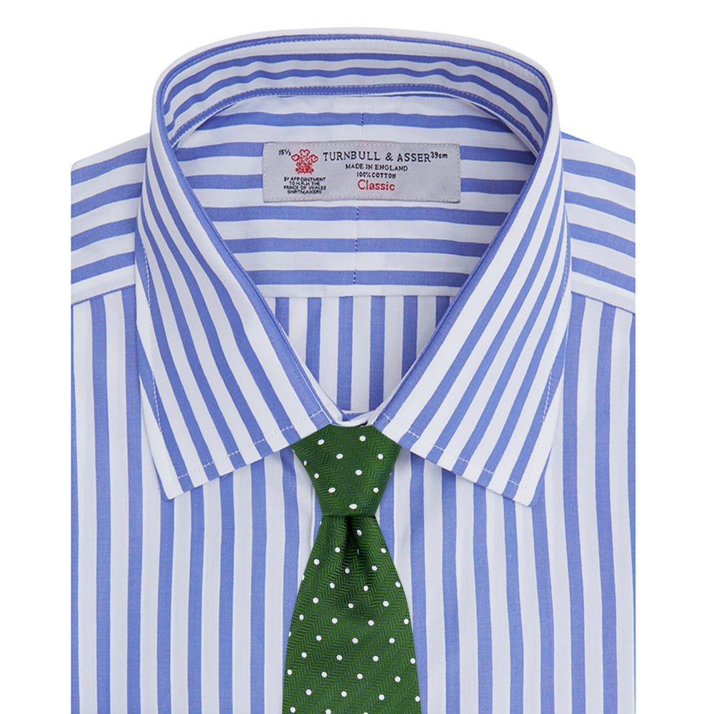 The Turnbull & Asser Blue and White Candy Stripe Shirt features a T&A collar, 3-button cuffs, and crisp white buttons, displayed neatly folded against a white background for a classic look.