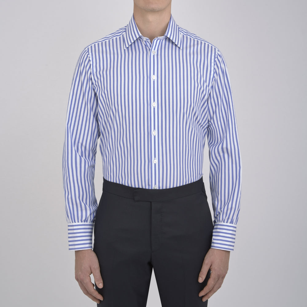 The Turnbull & Asser Blue and White Candy Stripe Shirt features a T&A collar, 3-button cuffs, and crisp white buttons, displayed neatly folded against a white background for a classic look.