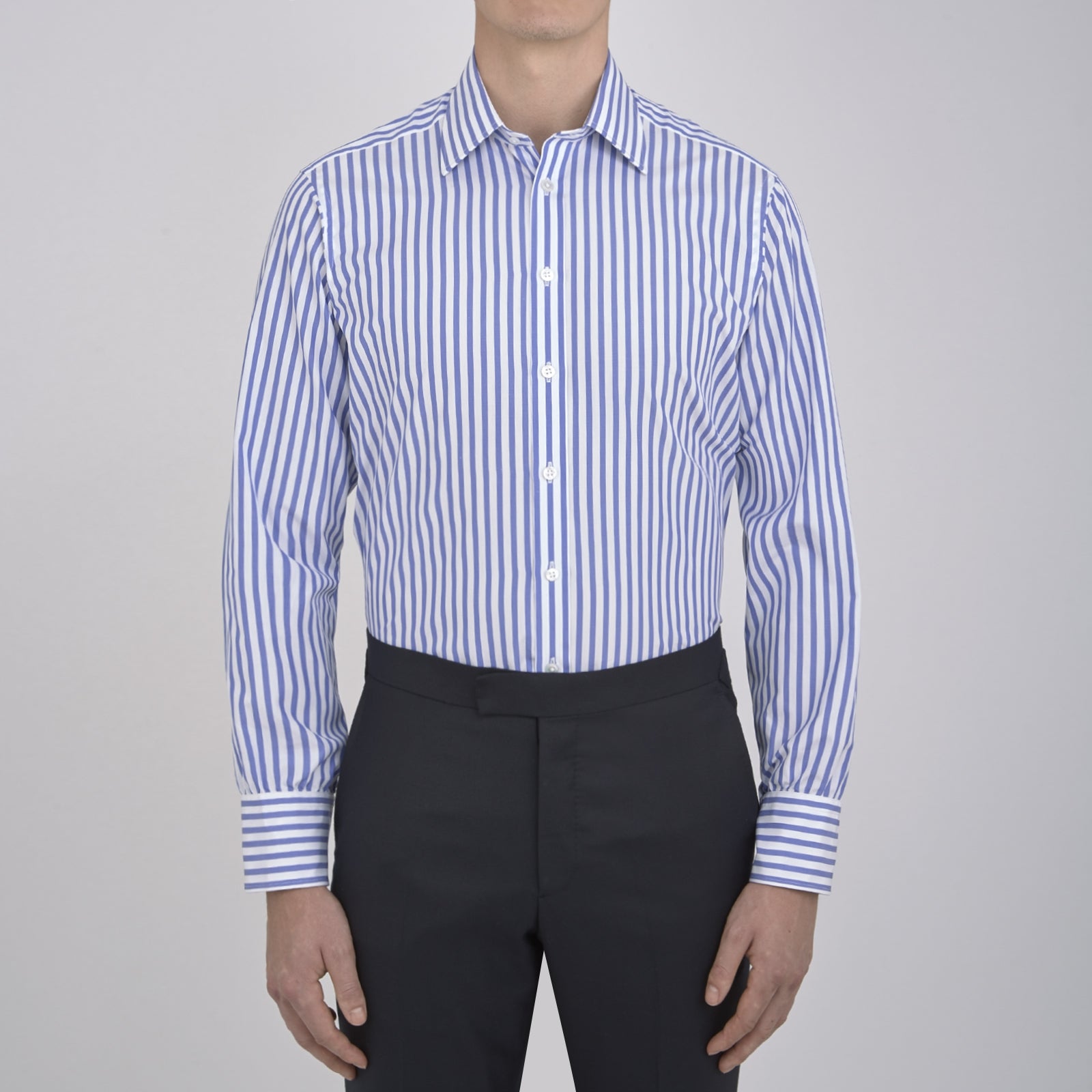 View 2 of product The Turnbull & Asser Blue and White Candy Stripe Shirt features a T&A collar, 3-button cuffs, and crisp white buttons, displayed neatly folded against a white background for a classic look.