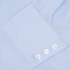 View 6 of product The Turnbull & Asser Light Blue Fine Check Shirt for men features a T&A collar, 3-button cuffs, classic white buttons, and a refined check design with a visible label inside the collar.
