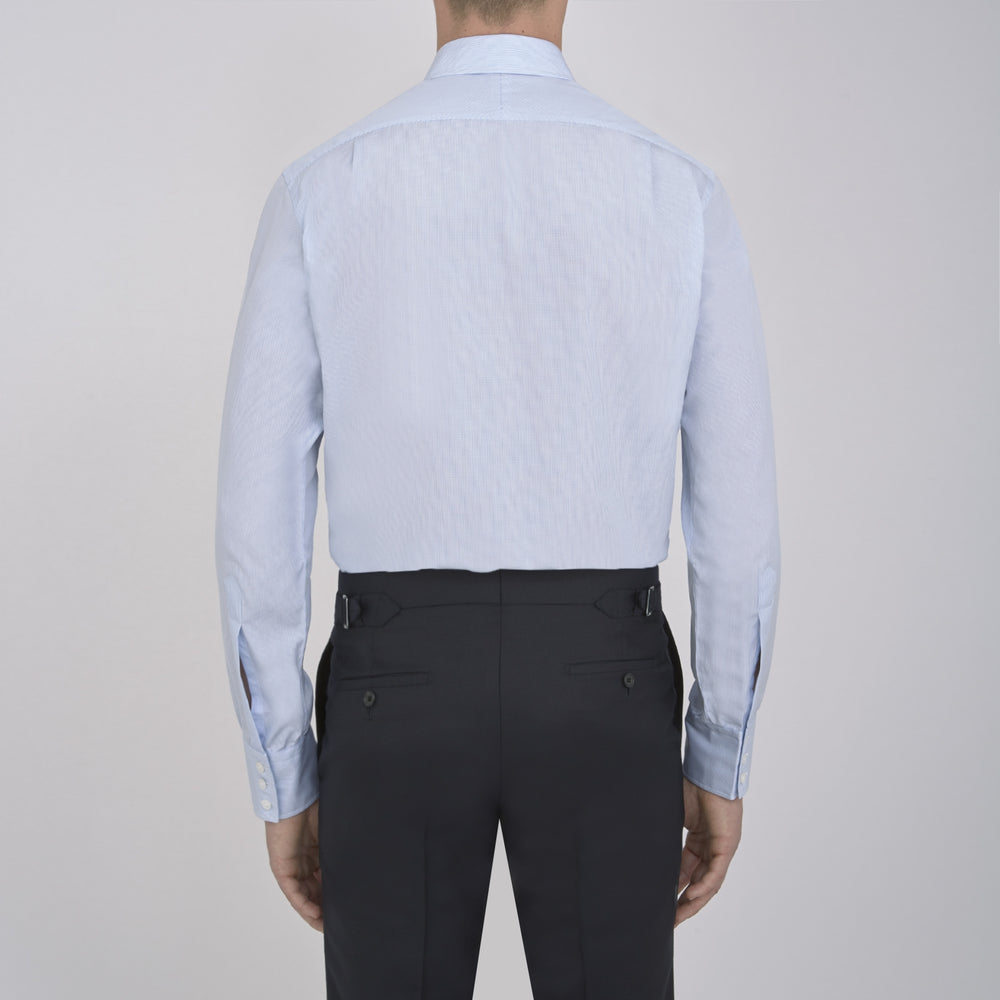 The Turnbull & Asser Light Blue Fine Check Shirt for men features a T&A collar, 3-button cuffs, classic white buttons, and a refined check design with a visible label inside the collar.