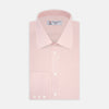 View 1 of product The Turnbull & Asser Pink Fine Check Shirt features a T&A collar, 3-button cuffs, and a subtle pink check design, made from fine cotton. Displayed neatly folded against a plain backdrop.