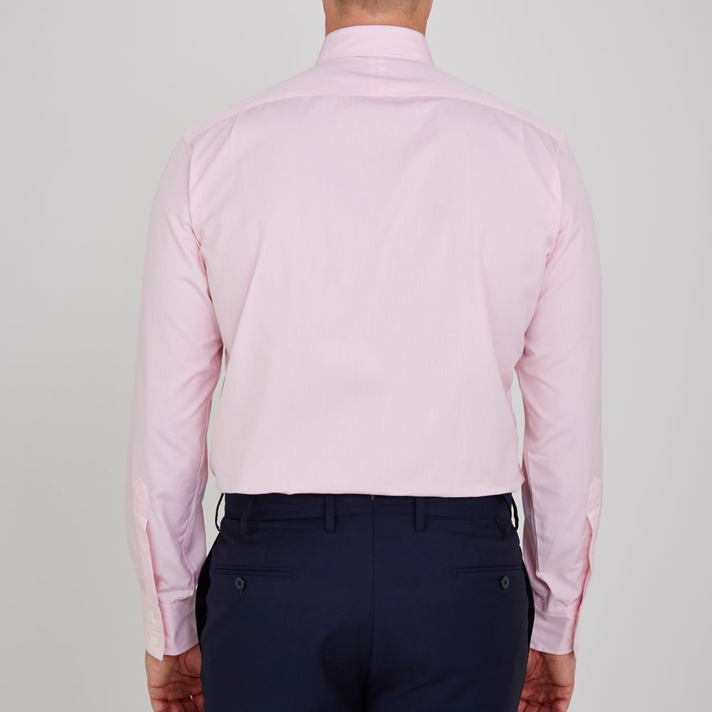 The Turnbull & Asser Pink Fine Check Shirt features a T&A collar, 3-button cuffs, and a subtle pink check design, made from fine cotton. Displayed neatly folded against a plain backdrop.