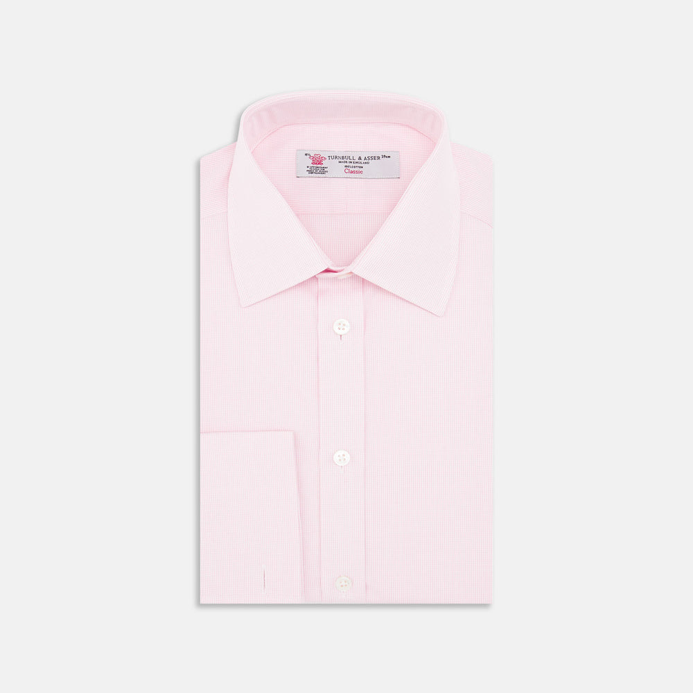 The Turnbull & Asser Pink Fine Check Shirt features a T&A collar, double cuffs, and classic white buttons, neatly folded and displayed against a plain white background.