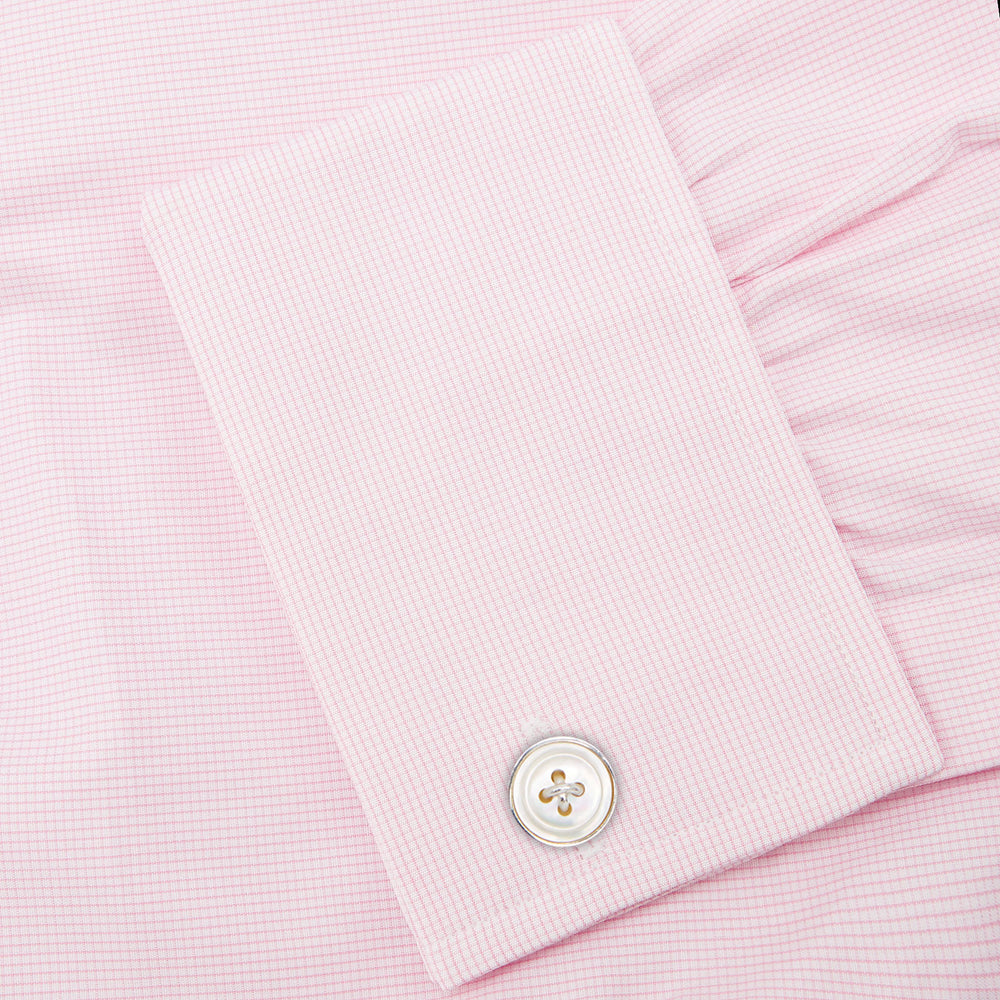 The Turnbull & Asser Pink Fine Check Shirt features a T&A collar, double cuffs, and classic white buttons, neatly folded and displayed against a plain white background.