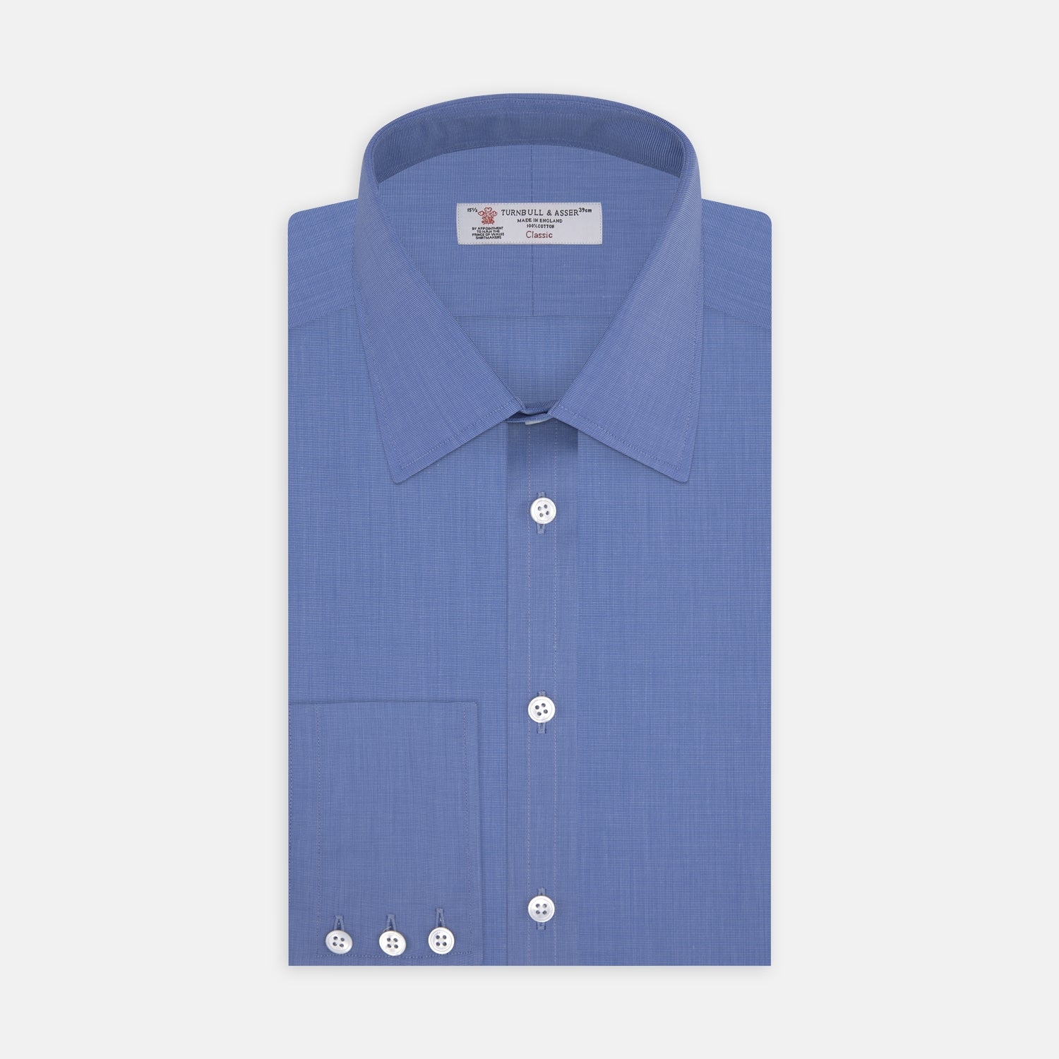View 1 of product The Turnbull & Asser Dark Blue End-On-End Shirt features a T&A collar and 3-button cuffs, displayed neatly folded on a white background. Ideal for pairing with a navy suit, the label inside the collar is visible.