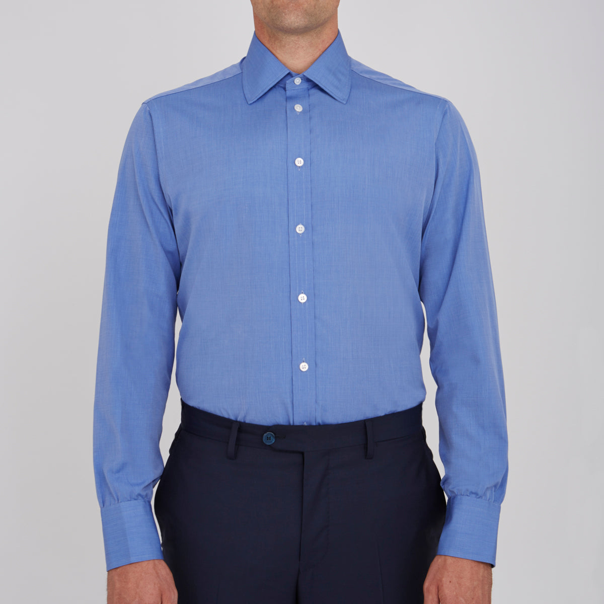 View 2 of product The Turnbull & Asser Dark Blue End-On-End Shirt features a T&A collar and 3-button cuffs, displayed neatly folded on a white background. Ideal for pairing with a navy suit, the label inside the collar is visible.