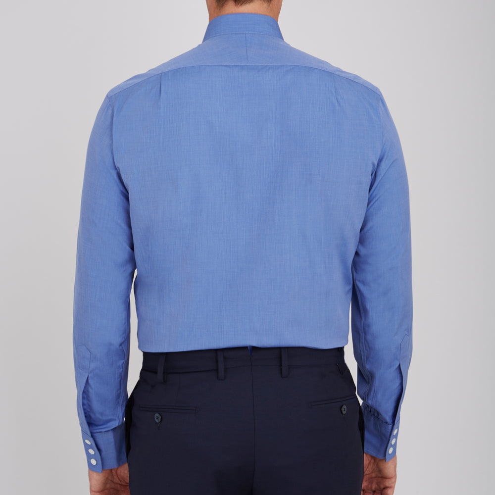 The Turnbull & Asser Dark Blue End-On-End Shirt features a T&A collar and 3-button cuffs, displayed neatly folded on a white background. Ideal for pairing with a navy suit, the label inside the collar is visible.