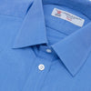 View 5 of product The Turnbull & Asser Dark Blue End-On-End Shirt features a T&A collar and 3-button cuffs, displayed neatly folded on a white background. Ideal for pairing with a navy suit, the label inside the collar is visible.