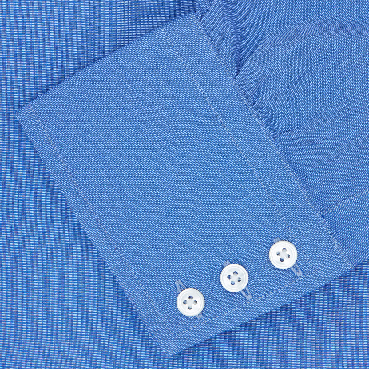 View 6 of product The Turnbull & Asser Dark Blue End-On-End Shirt features a T&A collar and 3-button cuffs, displayed neatly folded on a white background. Ideal for pairing with a navy suit, the label inside the collar is visible.