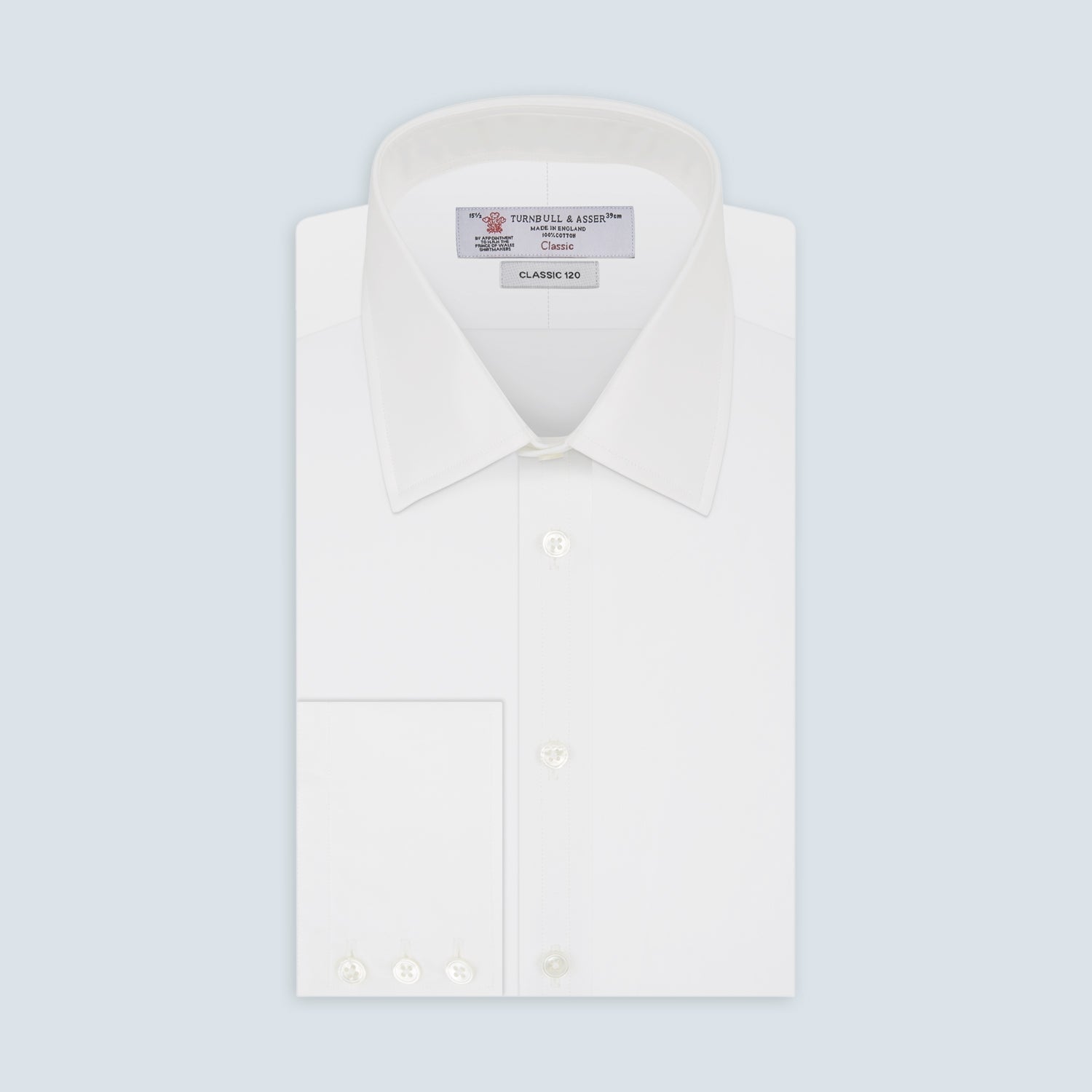 View 1 of product The Turnbull & Asser Two-Fold 120 White Shirt features a T&A collar and 3-button cuffs—an everyday essential, displayed against a light blue background.