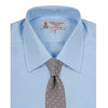 View 4 of product The Turnbull & Asser Two-Fold 200 Blue Cotton Shirt features a T&A collar, double cuffs, white buttons, and a visible label inside the collar, displayed neatly folded on a plain white background for superior breathability.