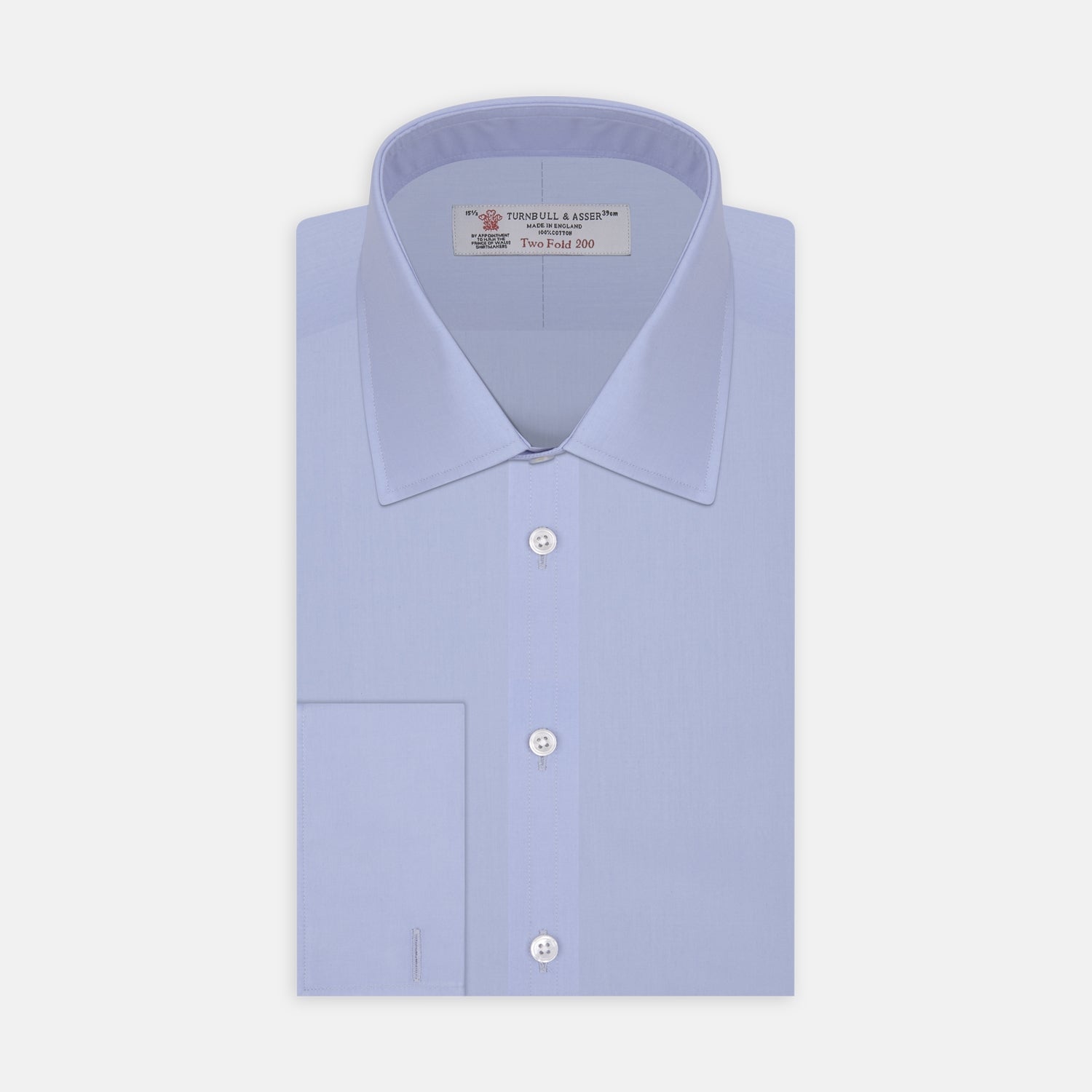View 1 of product The Turnbull & Asser Two-Fold 200 Blue Cotton Shirt features a T&A collar, double cuffs, white buttons, and a visible label inside the collar, displayed neatly folded on a plain white background for superior breathability.