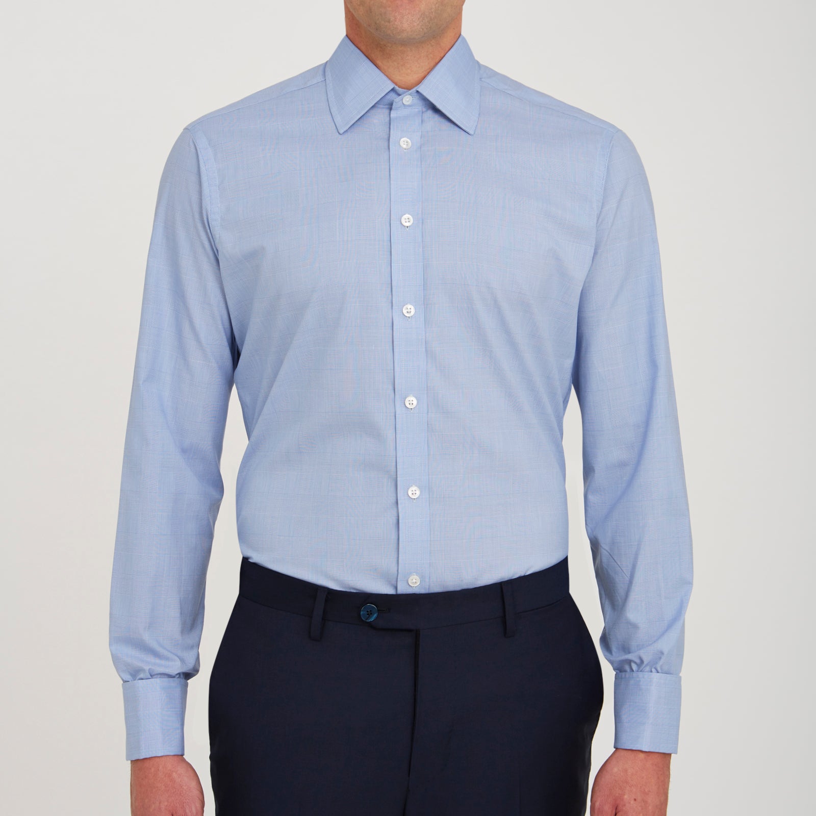 View 2 of product The Turnbull & Asser Blue Prince of Wales Check Shirt features a T&A collar and double cuffs, shown against a white background—ideal for timeless, minimalist style.