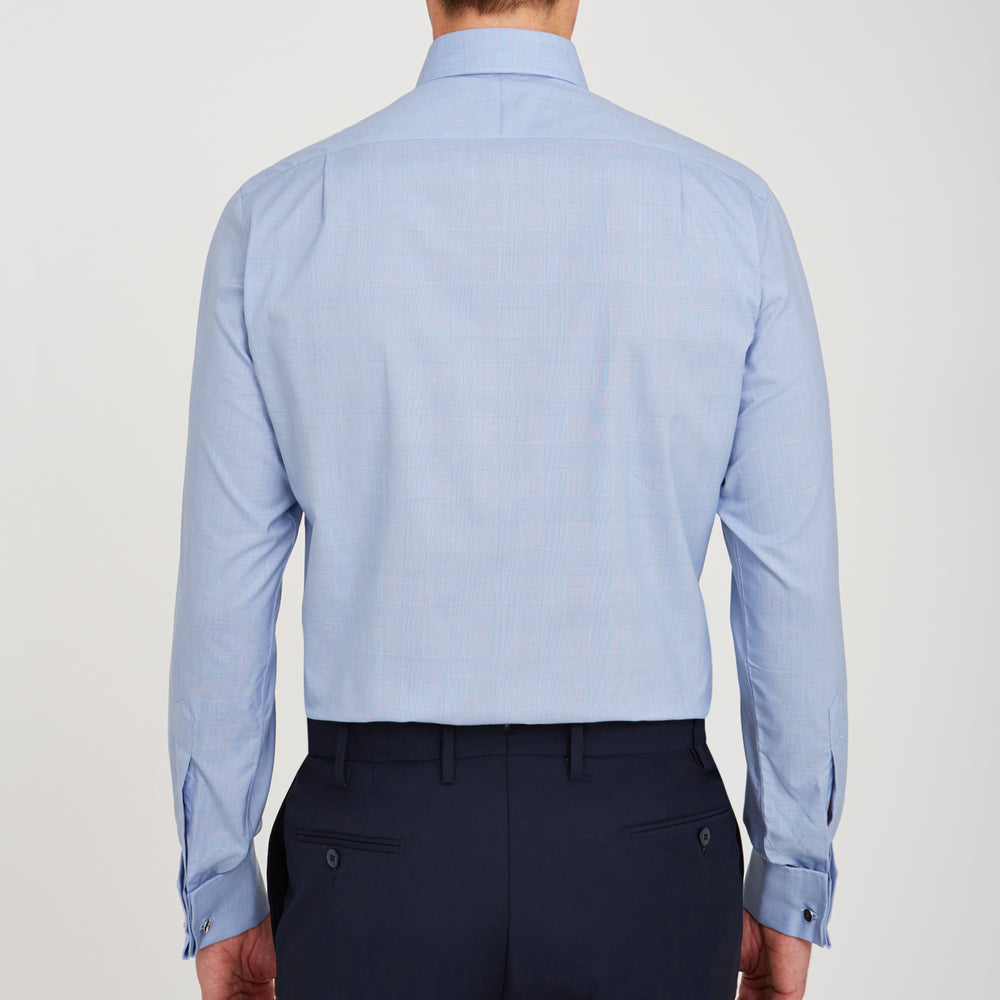 The Turnbull & Asser Blue Prince of Wales Check Shirt features a T&A collar and double cuffs, shown against a white background—ideal for timeless, minimalist style.