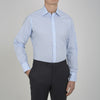 View 2 of product The Sky Blue Micro-Check Cotton Shirt by Turnbull & Asser features a T&A collar and 3-button cuffs, offering a refined take on classic British style. The shirt is neatly folded, showcasing its signature elegance against a white background.