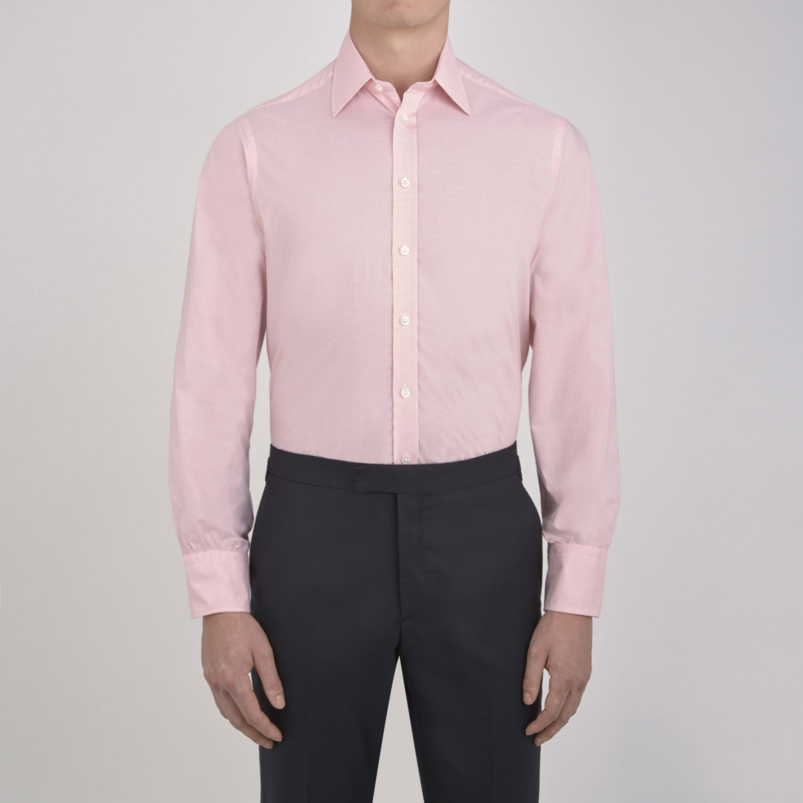 View 2 of product The Turnbull & Asser Pink Micro-Check Cotton Shirt features a T&A collar, 3-button cuffs, and a refined micro-check pattern, shown neatly folded against a white background.