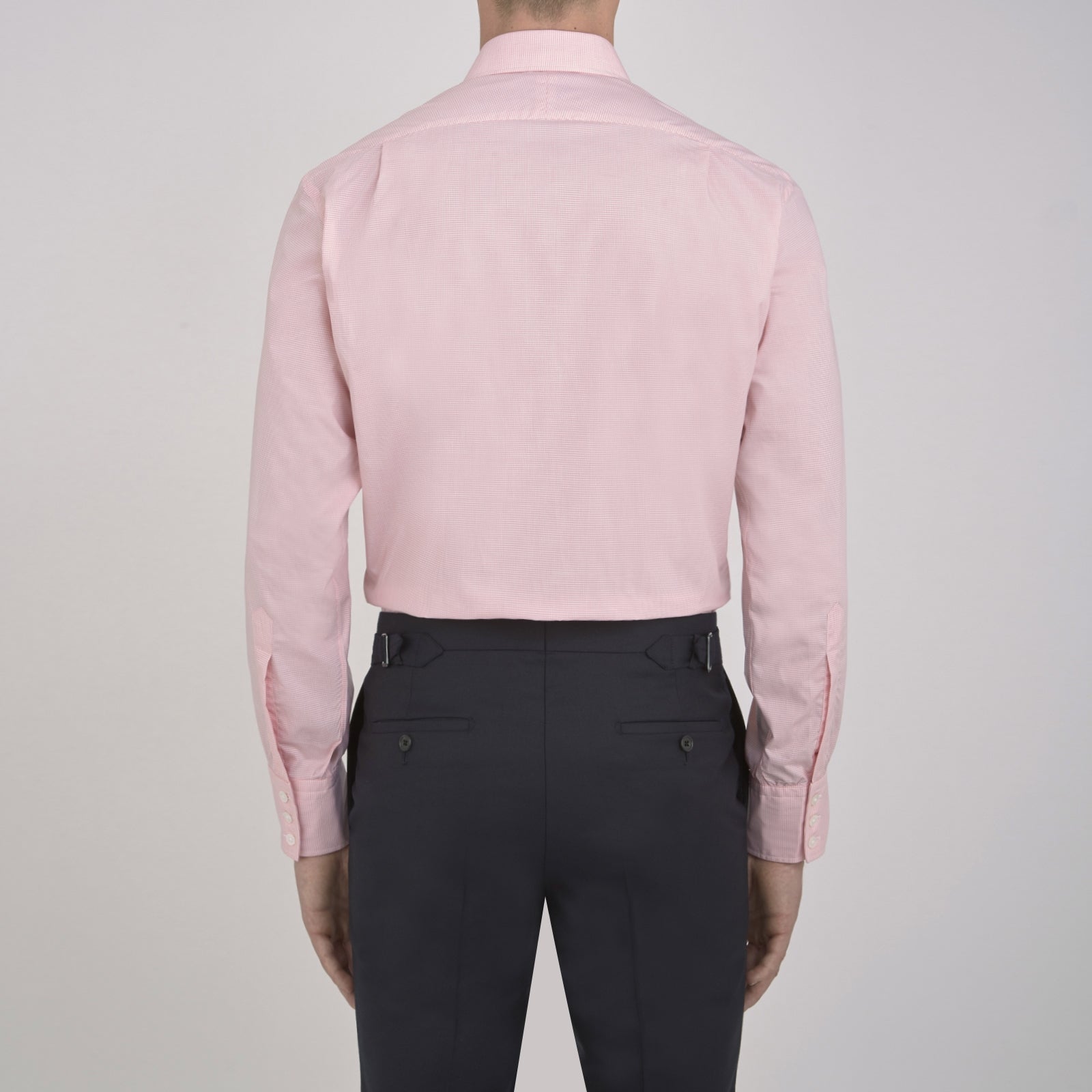 View 3 of product The Turnbull & Asser Pink Micro-Check Cotton Shirt features a T&A collar, 3-button cuffs, and a refined micro-check pattern, shown neatly folded against a white background.