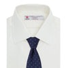 View 4 of product The Turnbull & Asser Cream Herringbone Superfine Cotton Shirt features a T&A collar and 3-button cuffs, ideal for minimalist style or bold ties, shown neatly folded against a plain white background.