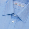 View 5 of product The Turnbull & Asser Blue Herringbone Superfine Cotton Shirt features a T&A collar and double cuffs—an essential for discerning gentlemen—shown folded on a plain white background.