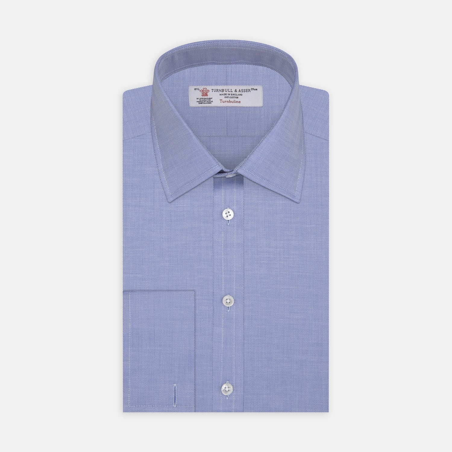 View 1 of product The Turnbull & Asser Blue Herringbone Superfine Cotton Shirt features a T&A collar and double cuffs—an essential for discerning gentlemen—shown folded on a plain white background.