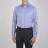 View 2 of product The Turnbull & Asser Blue Herringbone Superfine Cotton Shirt features a T&A collar and double cuffs—an essential for discerning gentlemen—shown folded on a plain white background.