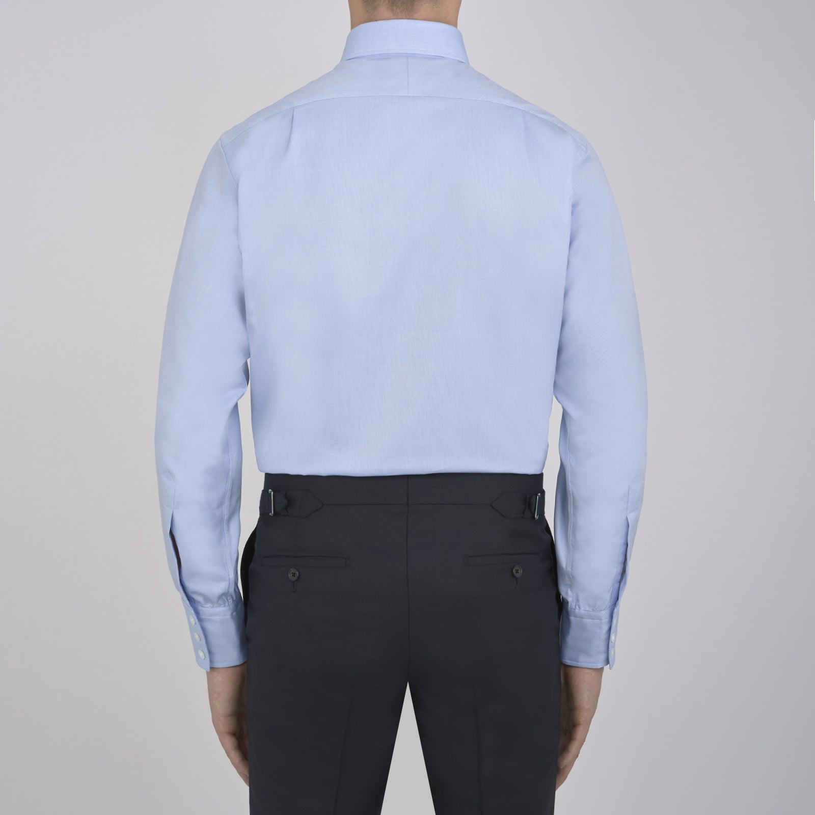 View 3 of product Turnbull & Asser's Light Blue Royal Oxford Cotton Shirt features a button-down collar, 3-button cuffs, and white buttons. Men's shirt comes neatly folded, with a branded neck label displaying garment details—ideal under a navy suit.