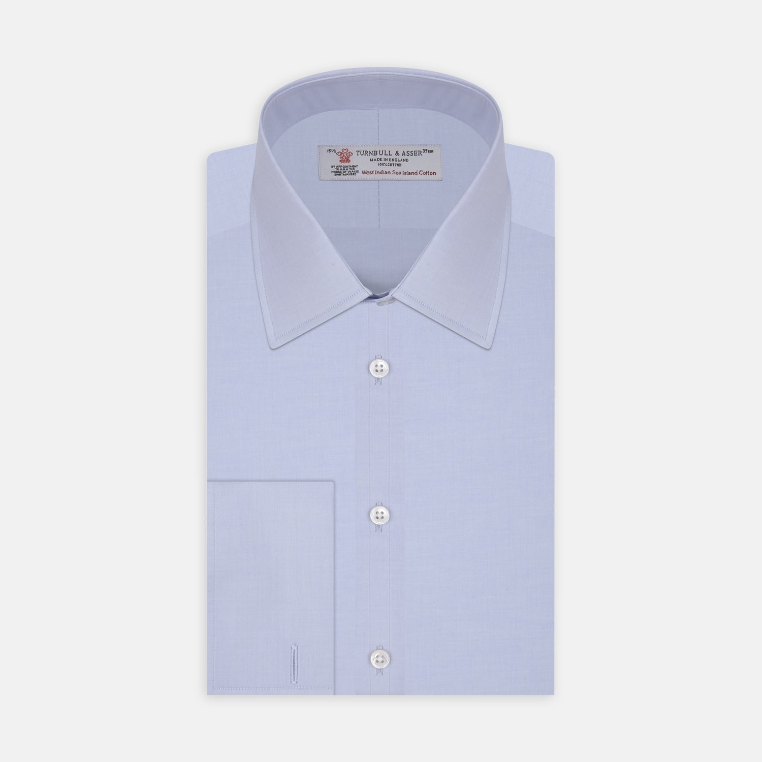 View 1 of product A neatly folded light blue long-sleeve dress shirt with a pointed collar and white buttons, styled with the Turnbull & Asser Monochrome Paisley Mill Silk Pocket Square (limited edition), displayed against a plain white background.
