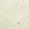 View 6 of product The Cream Sea Island Quality Cotton Shirt by Turnbull & Asser features a T&A collar and 3-button cuffs, crafted from premium cotton and displayed neatly folded against a plain white background.