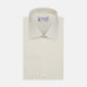 The Cream Sea Island Quality Cotton Shirt by Turnbull & Asser features a T&A collar and 3-button cuffs, crafted from premium cotton and displayed neatly folded against a plain white background.