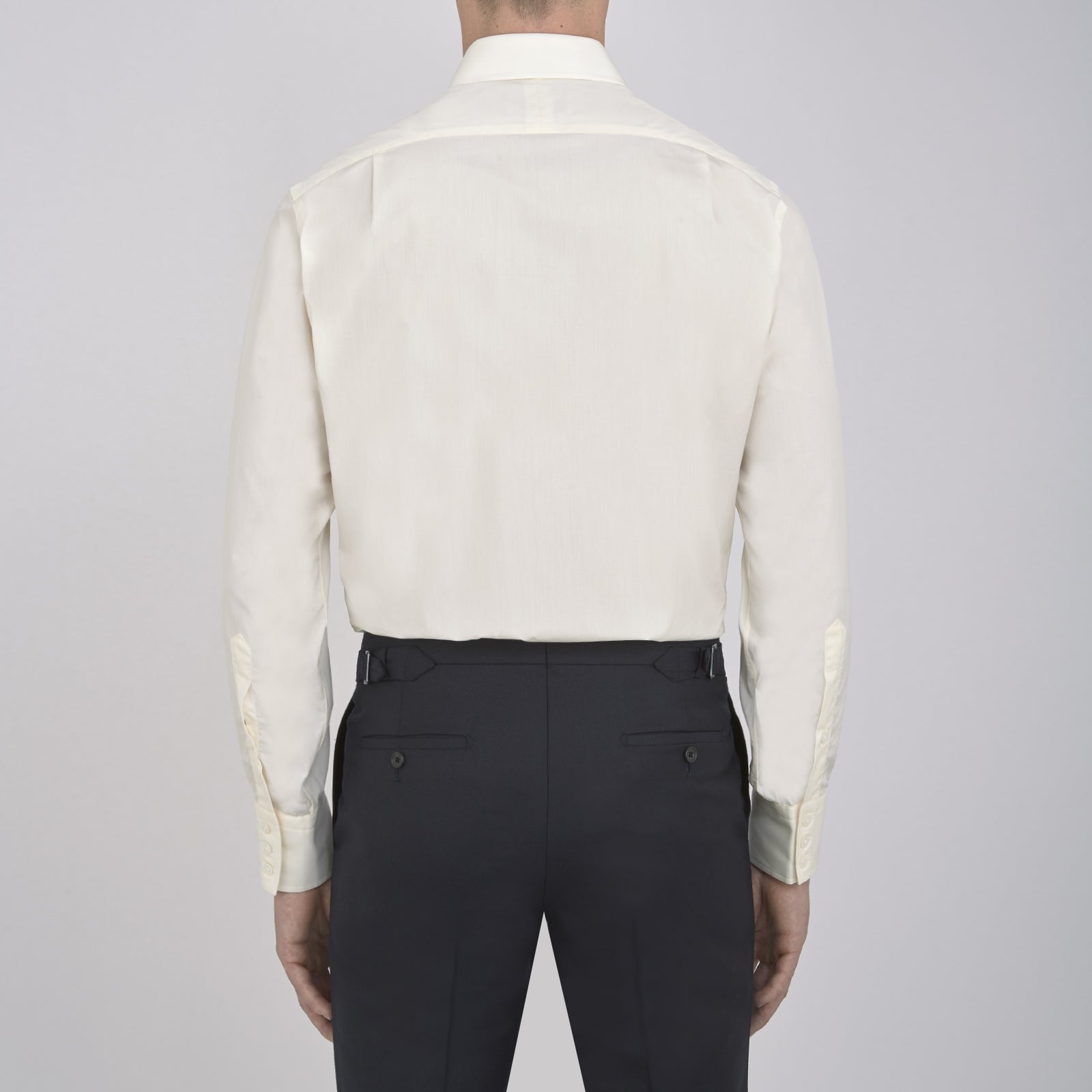 View 3 of product The Cream Sea Island Quality Cotton Shirt by Turnbull & Asser features a T&A collar and 3-button cuffs, crafted from premium cotton and displayed neatly folded against a plain white background.