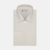 View 1 of product The Turnbull & Asser Cream Sea Island Quality Cotton Shirt features a T&A collar, double cuffs, and a button-down front, elegantly displayed against a white background.