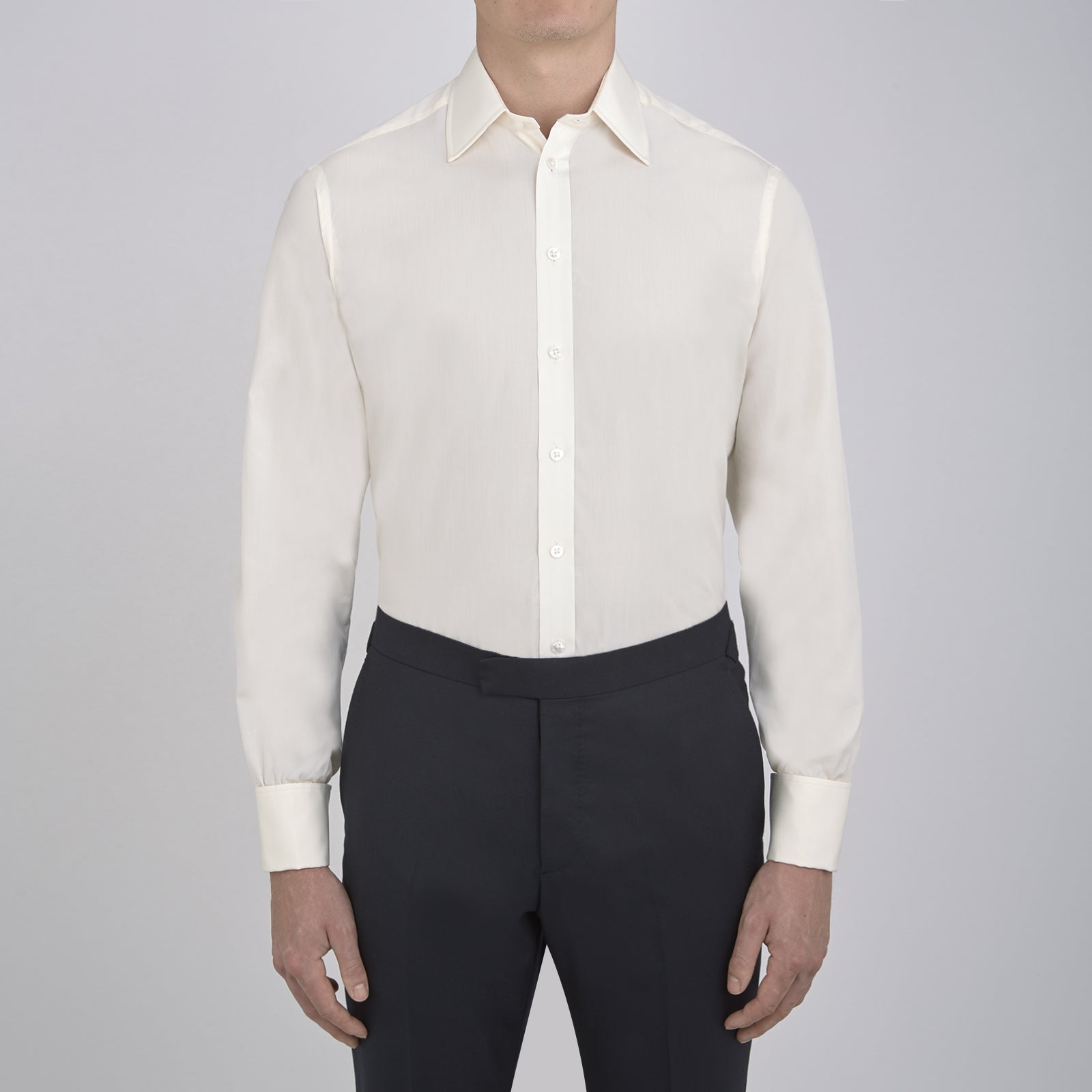 View 2 of product The Turnbull & Asser Cream Sea Island Quality Cotton Shirt features a T&A collar, double cuffs, and a button-down front, elegantly displayed against a white background.