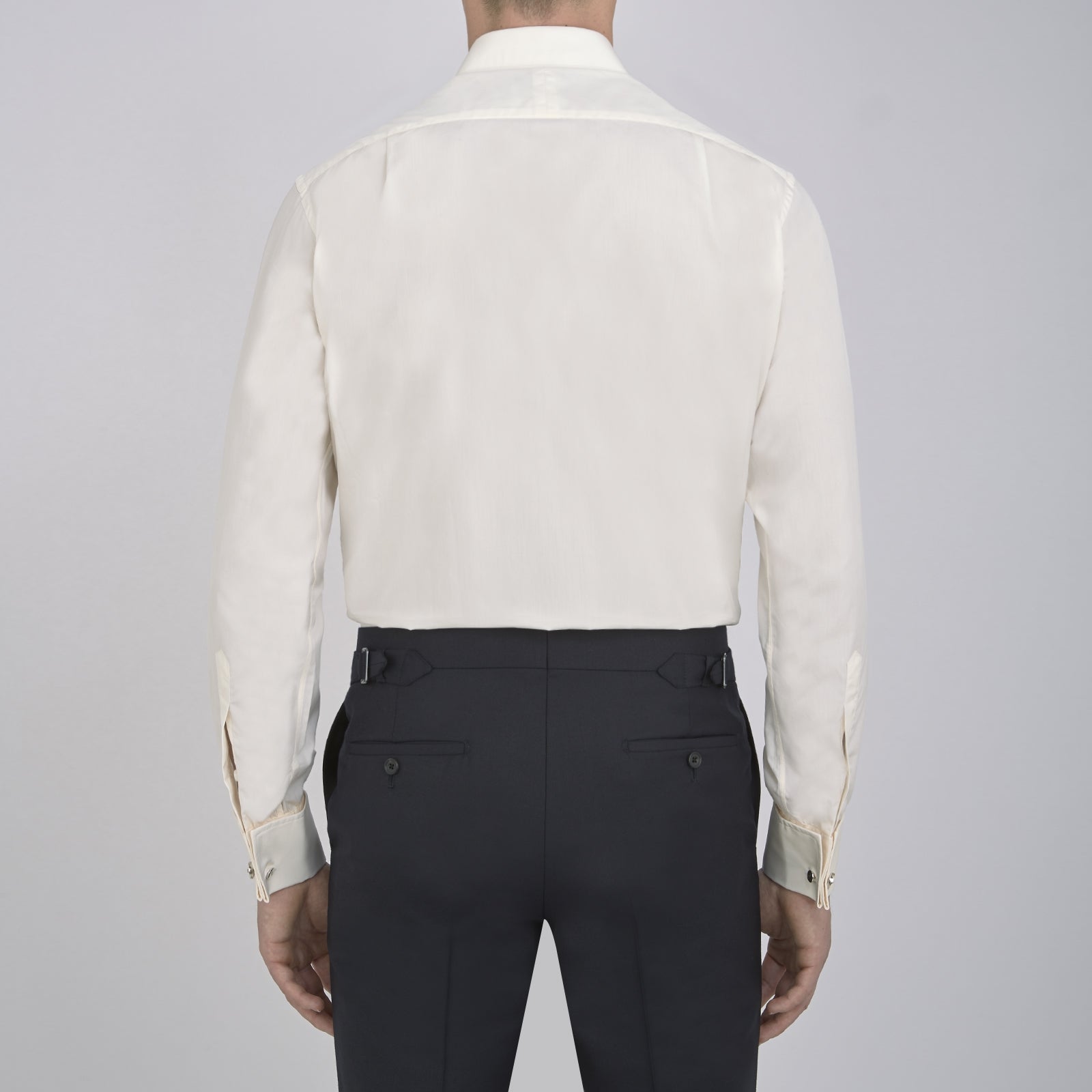 View 3 of product The Turnbull & Asser Cream Sea Island Quality Cotton Shirt features a T&A collar, double cuffs, and a button-down front, elegantly displayed against a white background.