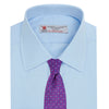 View 4 of product A neatly folded Light Blue Sea Island Quality Cotton Shirt by Turnbull & Asser, featuring a T&A collar and double cuffs, is displayed against a plain white background with the brand label visible inside the collar.