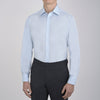 View 2 of product A neatly folded Light Blue Sea Island Quality Cotton Shirt by Turnbull & Asser, featuring a T&A collar and double cuffs, is displayed against a plain white background with the brand label visible inside the collar.