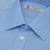 View 5 of product The Turnbull & Asser Blue Sea Island Quality Cotton Shirt features a T&A collar, double cuffs, and is showcased neatly folded on a plain white background.