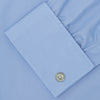 View 6 of product The Turnbull & Asser Blue Sea Island Quality Cotton Shirt features a T&A collar, double cuffs, and is showcased neatly folded on a plain white background.