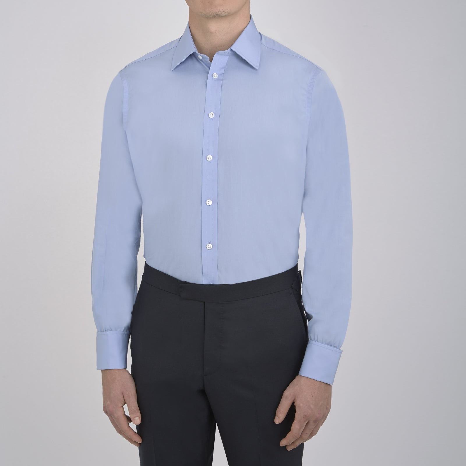 View 2 of product The Turnbull & Asser Blue Sea Island Quality Cotton Shirt features a T&A collar, double cuffs, and is showcased neatly folded on a plain white background.