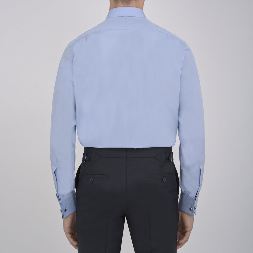 The Turnbull & Asser Blue Sea Island Quality Cotton Shirt features a T&A collar, double cuffs, and is showcased neatly folded on a plain white background.