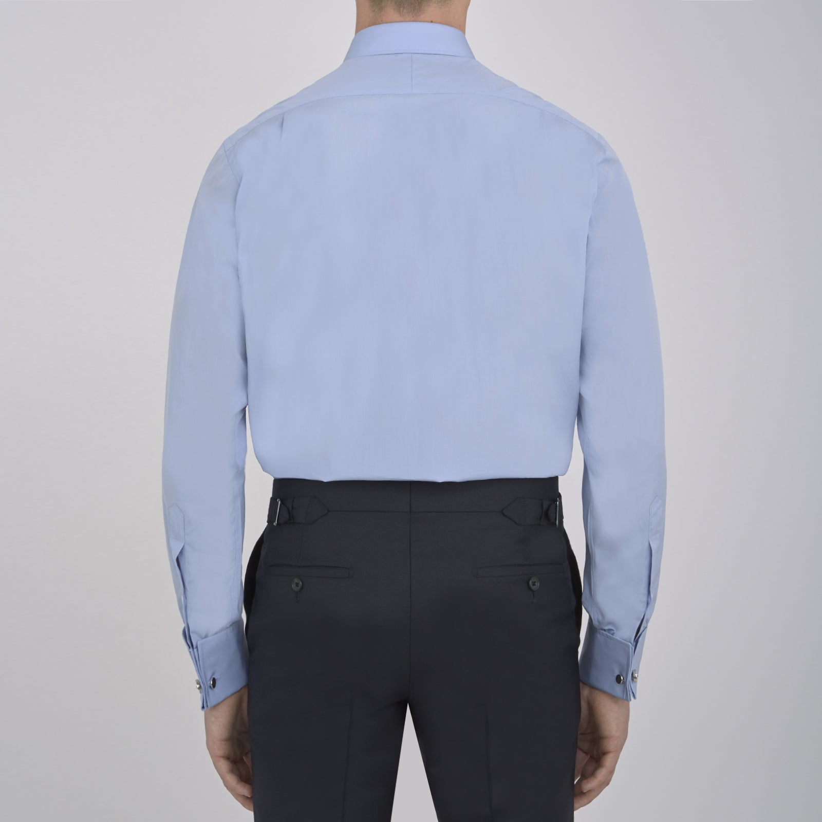 View 3 of product The Turnbull & Asser Blue Sea Island Quality Cotton Shirt features a T&A collar, double cuffs, and is showcased neatly folded on a plain white background.