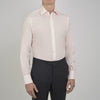 View 2 of product A slim black herringbone silk tie by Turnbull & Asser is paired with a neatly folded light pink long-sleeve dress shirt with a classic collar and white buttons, all displayed on a plain white background.