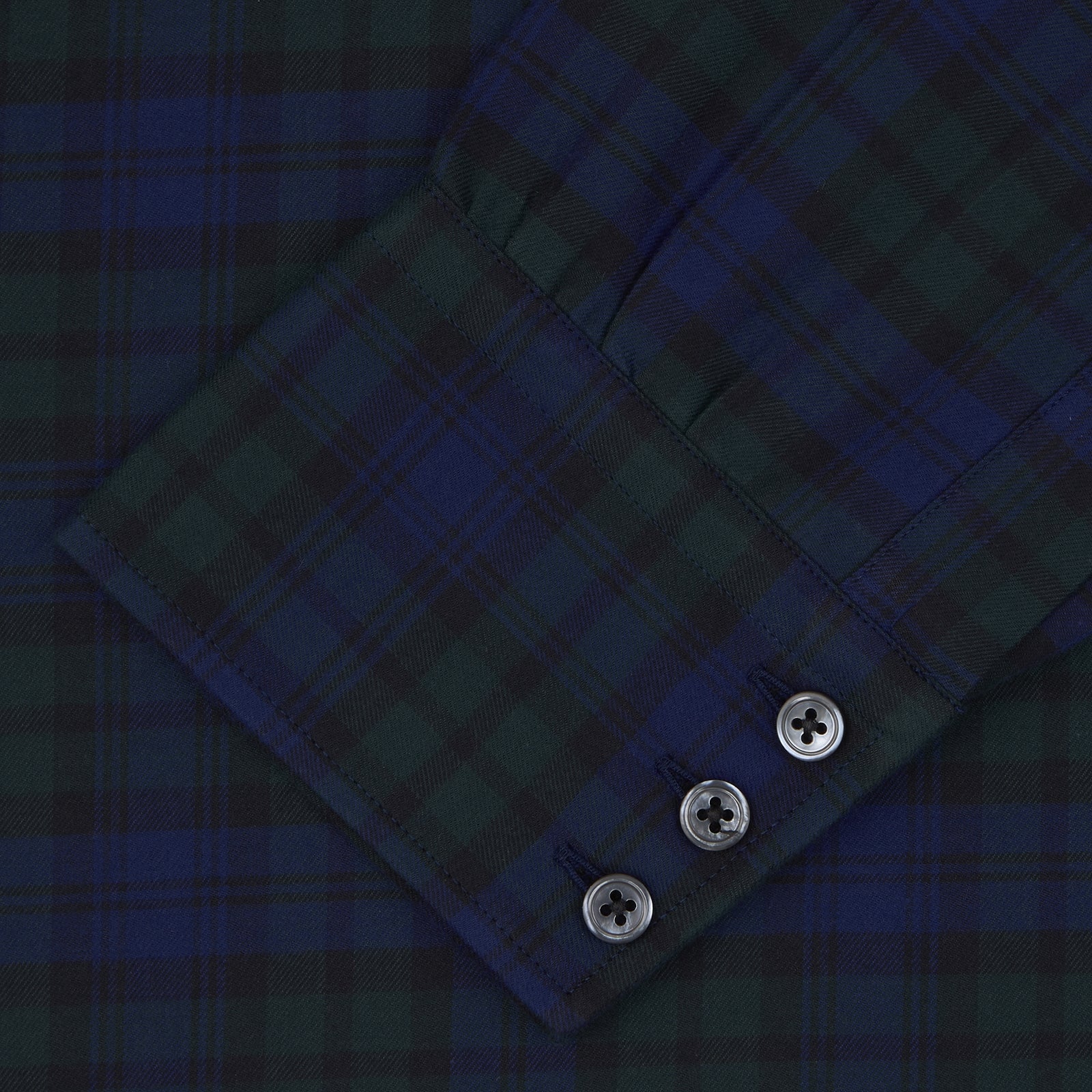 View 4 of product The Turnbull & Asser Blackwatch Brushed Cotton Shirt features a T&A collar, button cuffs, and a stylish dark blue and green plaid—perfect for any seasonal collection. Displayed here neatly folded on a plain white background.