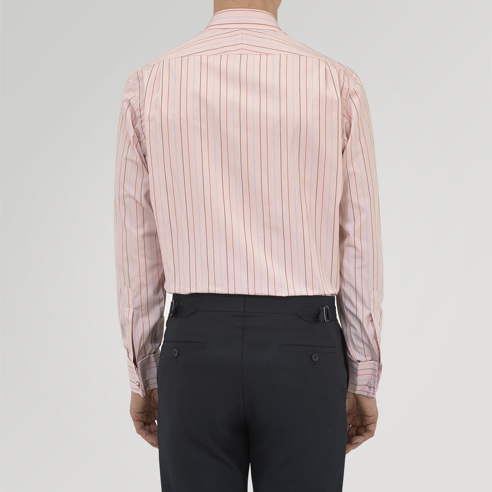 Turnbull & Asser’s Pink, Red and Blue Pencil Stripe Shirt features a T&A collar, double cuffs, and multicolored vertical stripes on a light pink base—perfect for adding spring style to your wardrobe.