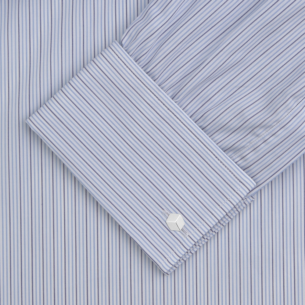 A Navy and Light Blue Supraluxe Stripe Shirt by Turnbull & Asser, featuring a T&A collar and double cuffs, is displayed neatly folded against a plain white background.