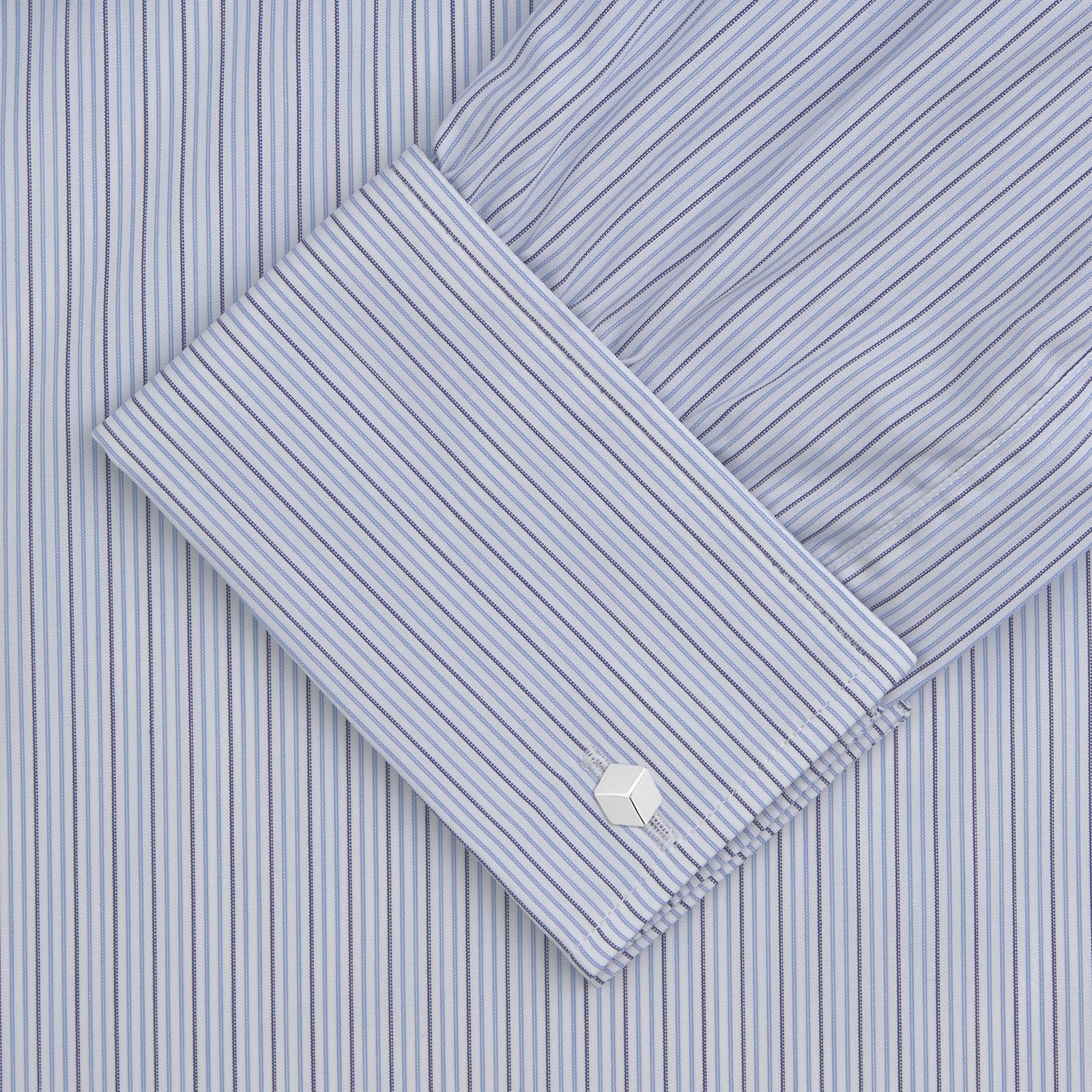 View 2 of product A Navy and Light Blue Supraluxe Stripe Shirt by Turnbull & Asser, featuring a T&A collar and double cuffs, is displayed neatly folded against a plain white background.