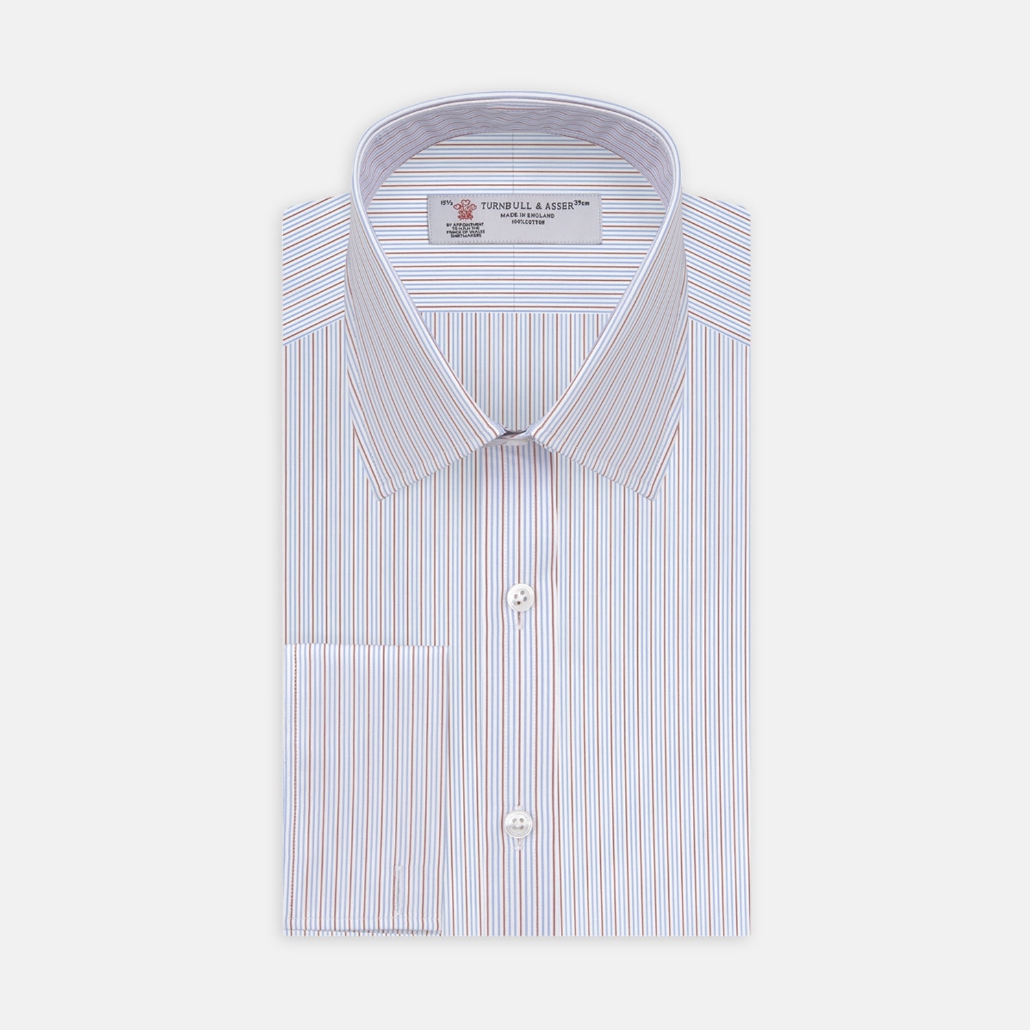 View 1 of product The Turnbull & Asser Red and Navy Supraluxe Stripe Shirt features a T&A collar, double cuffs, and thin vertical blue and red stripes on white premium cotton. Displayed folded against a plain white background.